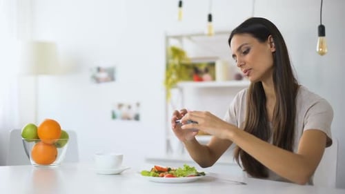 Young Food Blogger Making Salad Photos on Phone, Posting in Social Networks