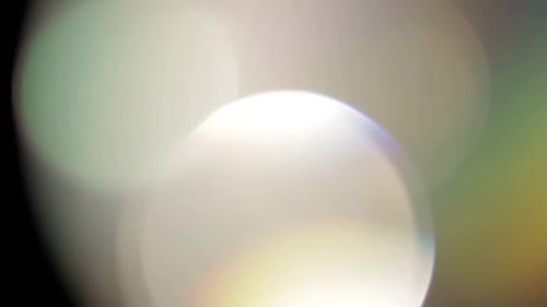 Multicolored Light Leaks Footage on Black Background. Stylizing Video, Transitions. Bokeh Effect