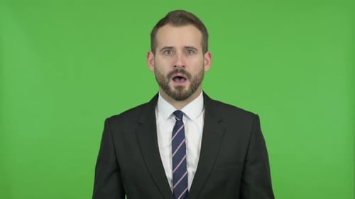 Young Businessman Getting Stressed Against Chroma Key