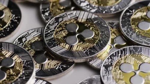 Close Up of Silver and Gold Ripple Coins