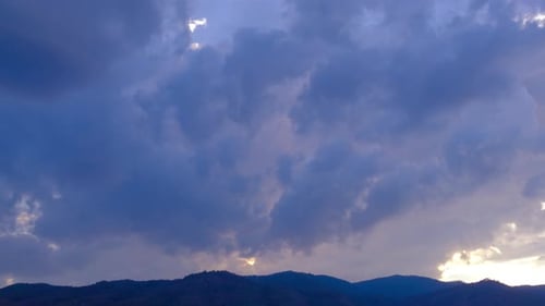Dramatic Clouds and Mountains at Sunrise or Sunset