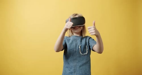 Happy Child Wearing VR Headset Having Fun