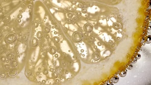 Close Up of Lemon Slice with Bubbles