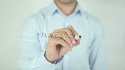 Man Writes 'Financial Crisis' on Transparent Surface