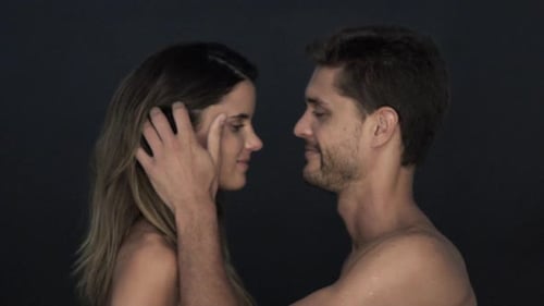 Intimate Couple Kissing in a Studio Setting