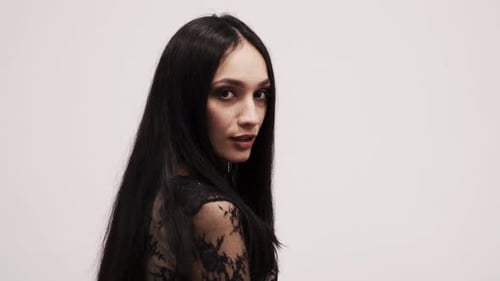 Elegant Woman Posing with Black Hair and Lace
