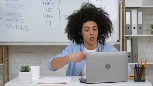 Enthusiastic Young Adult Teaching Online English Lesson