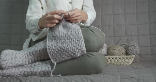 Woman Knitting Gray Scarf Indoors Daytime