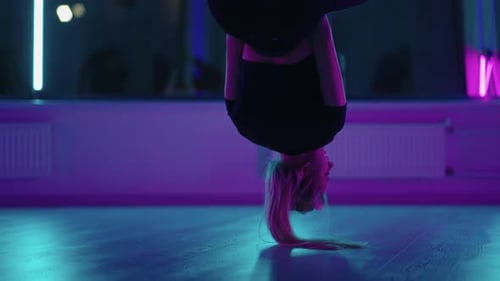 Woman Hanging Upside Down in Aerial Yoga Hammock