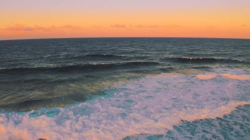 Ocean Waves Crashing at Sunset Aerial View