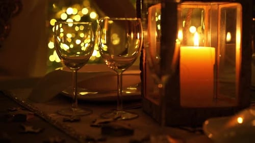 Elegant Holiday Table Setting with Warm Candlelight