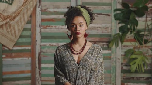 Smiling Woman in Green Headscarf Poses