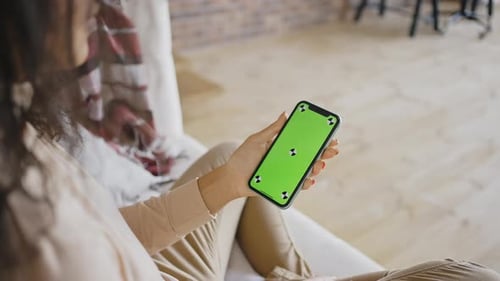 Phone with Green Screen and Chroma Key in Womans Hands