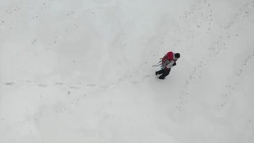Aerial View: Human Walk By Snowy Desert.
