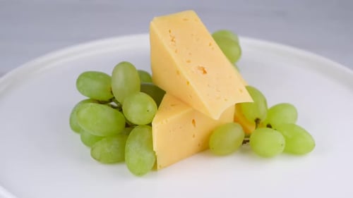 Cheese and Green Grapes on a Plate