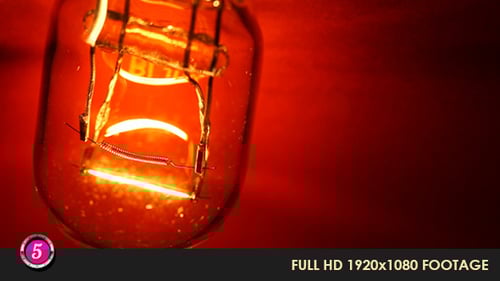 Illuminated Light Bulb Filament Close Up