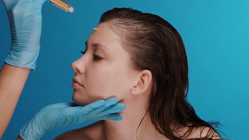 Profile of Female Cosmetology Clinic Customer Getting Dots with Mask By Syringe Filler