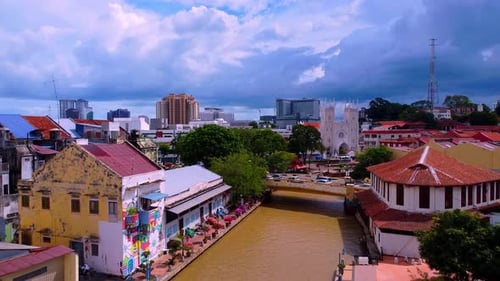Aerial shot of colorful malaysian city with river in middle of town,wide shot