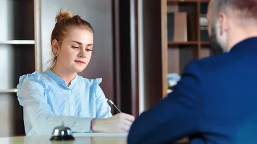 Portrait Female Receptionist Checkin at Reception of Businessman Guest Arriving at Hotel