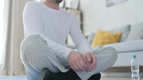Close Up of Legs of Man Doing Yoga at Home
