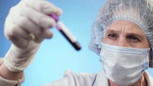 Positive Coronavirus Blood Sample Analyzed by Medical Professional