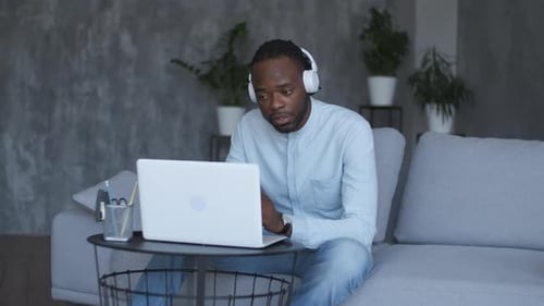 Adult Man Working on Laptop at Home