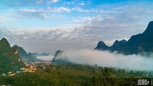 Aerial Time Lapse Sunrise in Mountain Peaks Landscape