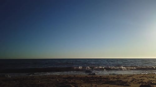 Beach time lapse on a clear sky