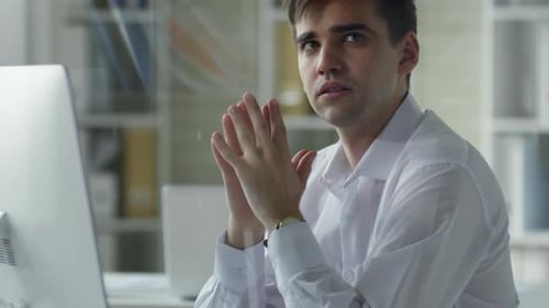 Man Looking Intently at Computer in Office