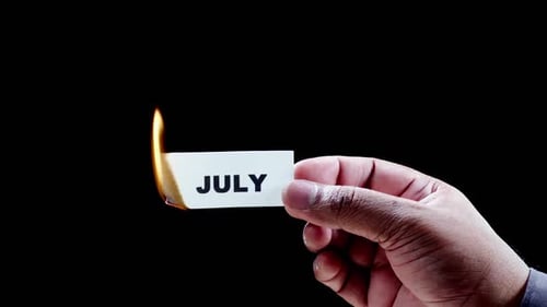 Burning Away July Card in Close Up Shot