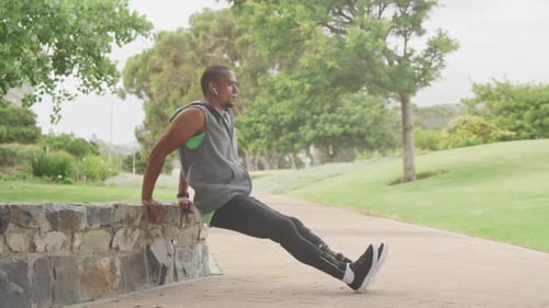 Man with Prosthetic Leg Exercising in Park