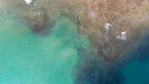 Aerial Top View of Turquoise Clear Sea Water with Coral Reef.