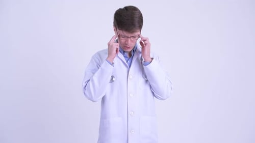 Stressed Young Adult Doctor with a Headache