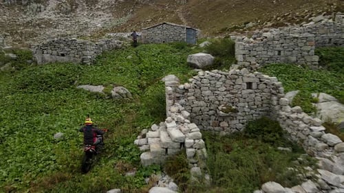 Motocross Between Abandoned Houses