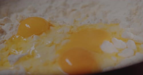 Egg Yolks in Flour Close Up Preparation