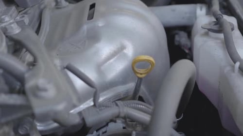 Hand Turns Yellow Engine Handle