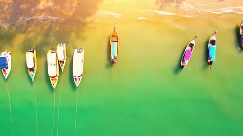 Passenger boats moored on the shores of the beautiful Andaman Sea.
