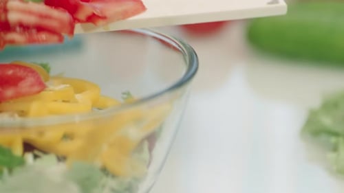 Preparing Fresh Salad With Vegetables In Bowl
