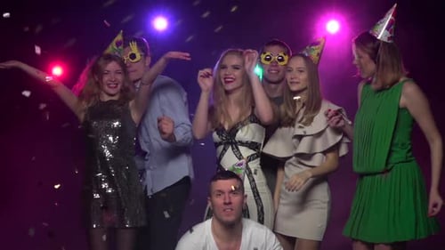 Friends Celebrating Birthday with Confetti at Night