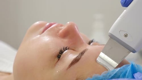 Beauty Clinic and Machine Cosmetology. Professional Cosmetologist Working with Ultrasonic Facial