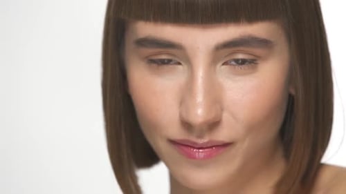 Woman with Bob Hairstyle Smiling on White Background