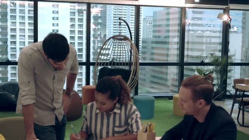 Creative Business People Group Having Conversation at Office Desk in Workplace