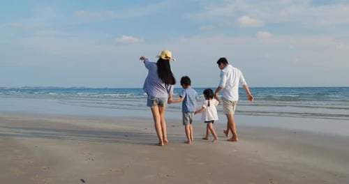 Family walking on the beach