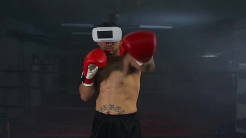 Junger Mann Boxen mit Virtual-Reality-Headset 26