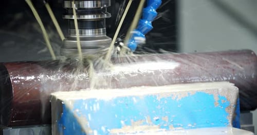 Close Up of a Milling Machine Working on a Big Piece of Metal Metallurgy
