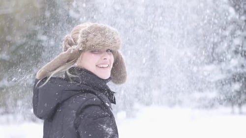 Happiness Lifestyle Portrait of Attractive Female Person Having Fun in Snow Weather