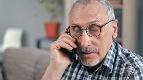 Mature Man Talking on the Phone