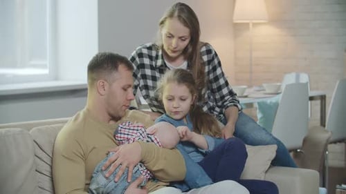 Family Togetherness on Couch in Home Living Room