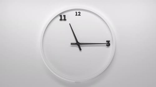 White Clock on White Backdrop with Black Numbers and Arrows