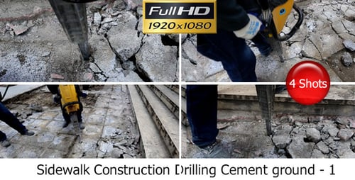 Worker Using Jackhammer to Break Concrete